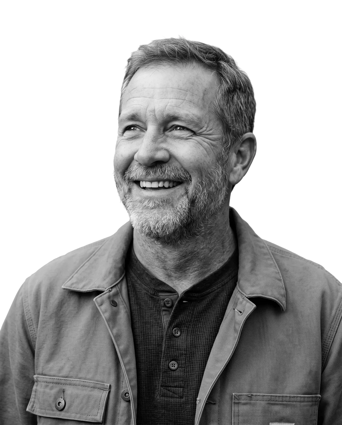 Owner of a family construction company, smiling and looking up